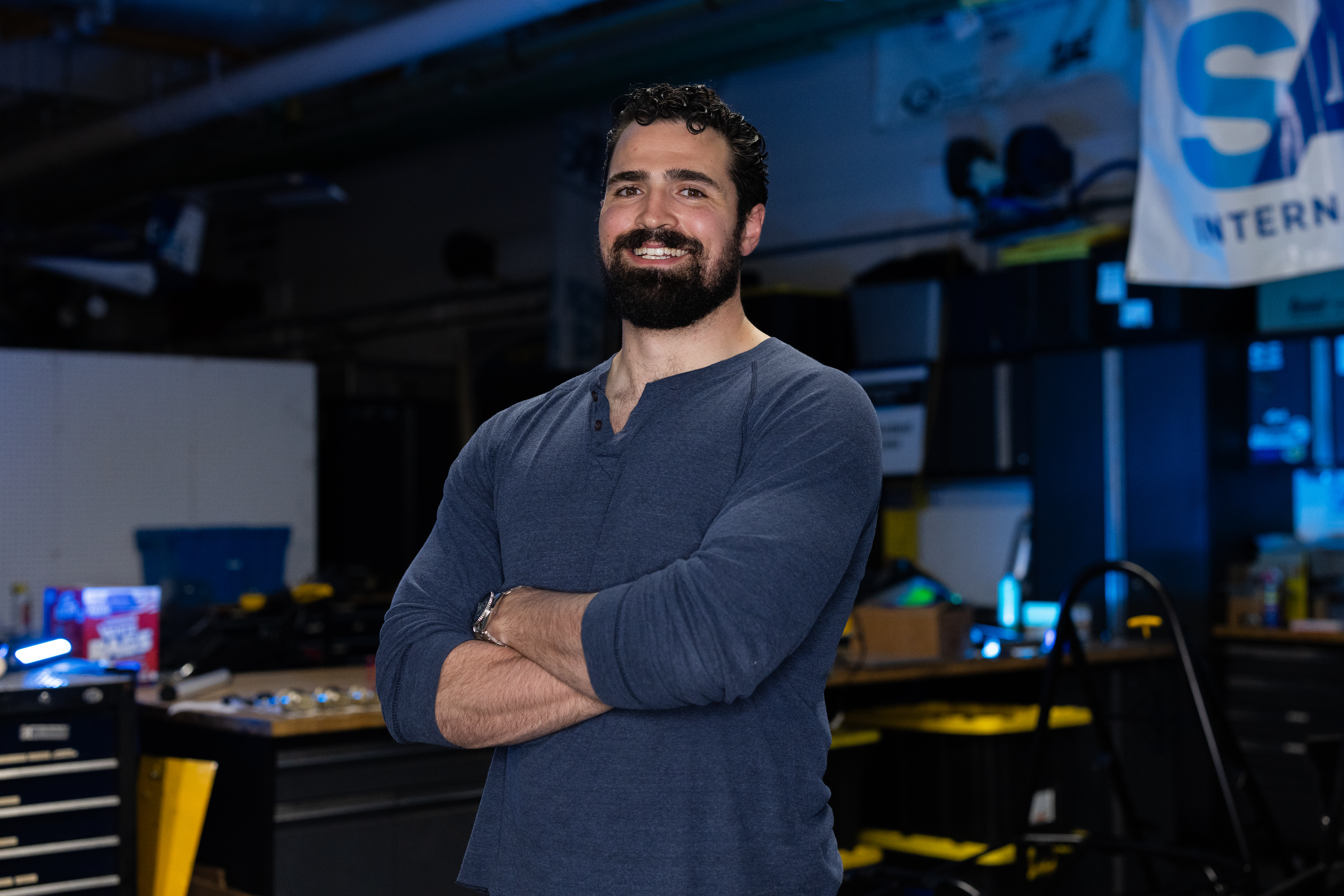 Chris Ordoobadi standing in the SAE Garage at Kettering University