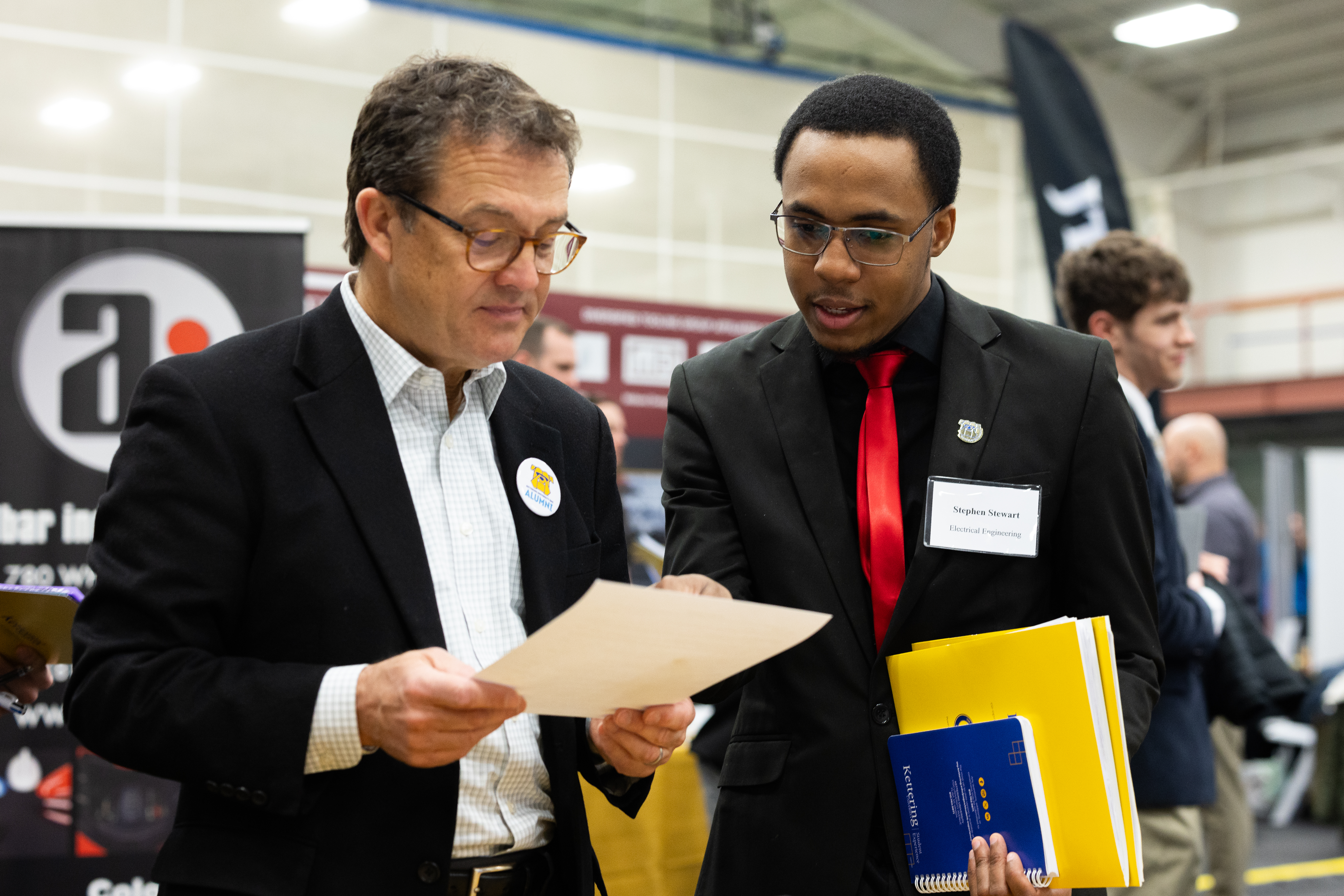 student talking with employer at employment fair