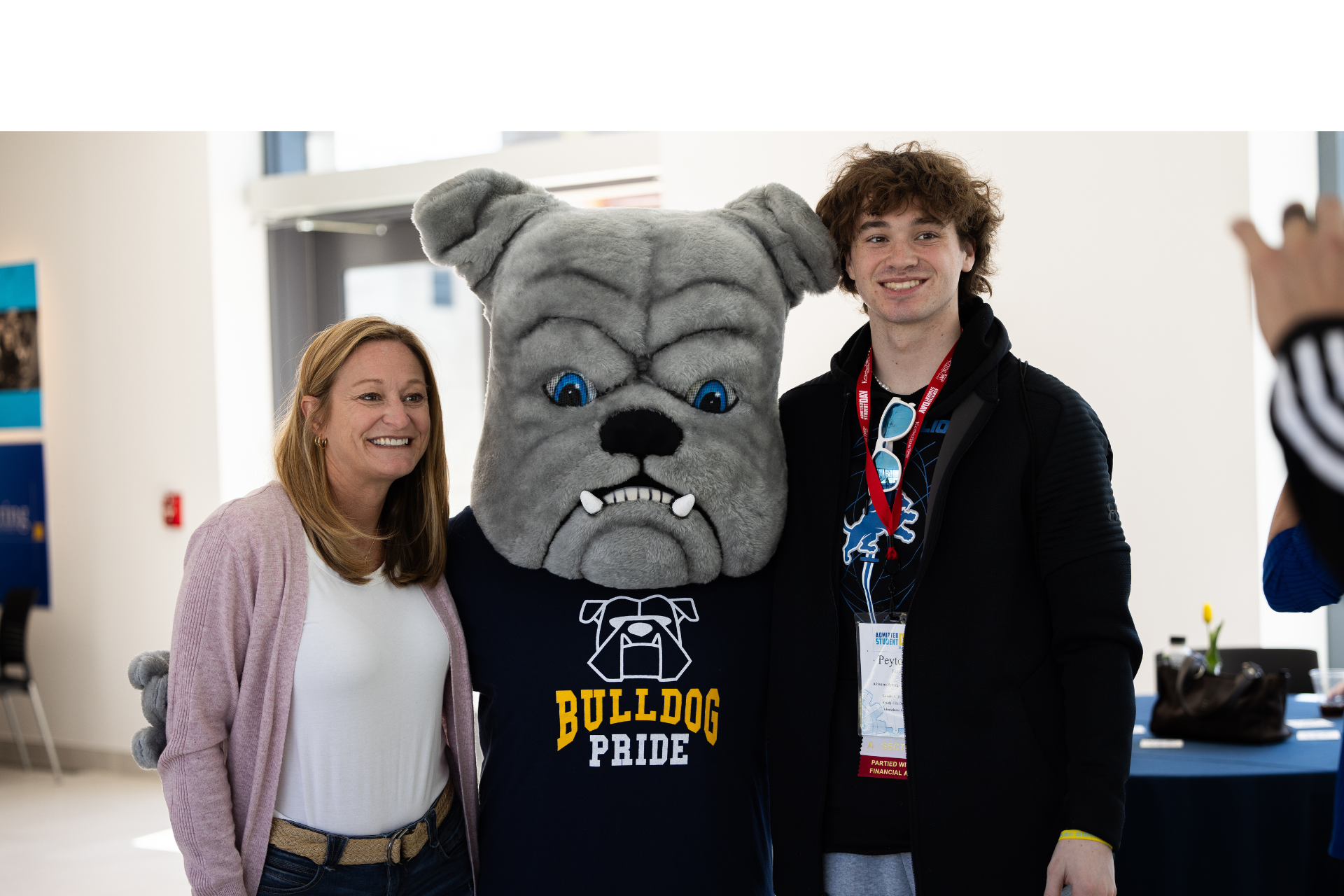 student and parent posing with General D