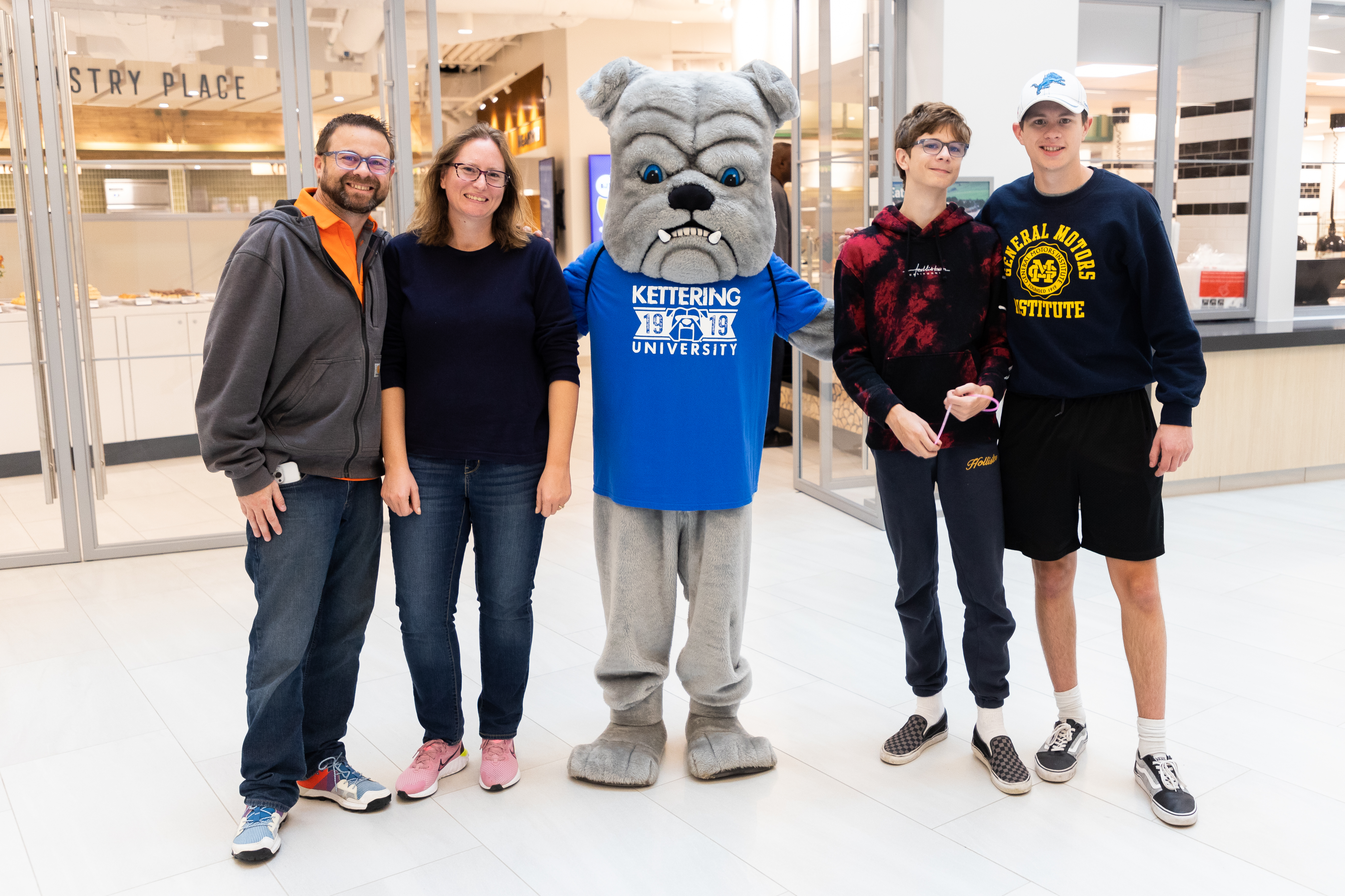 studen and family posing with General D