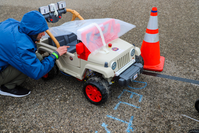 A student checks out his Power Wheel during the Square One Innovative Vehicle Design Challenge at Kettering University.