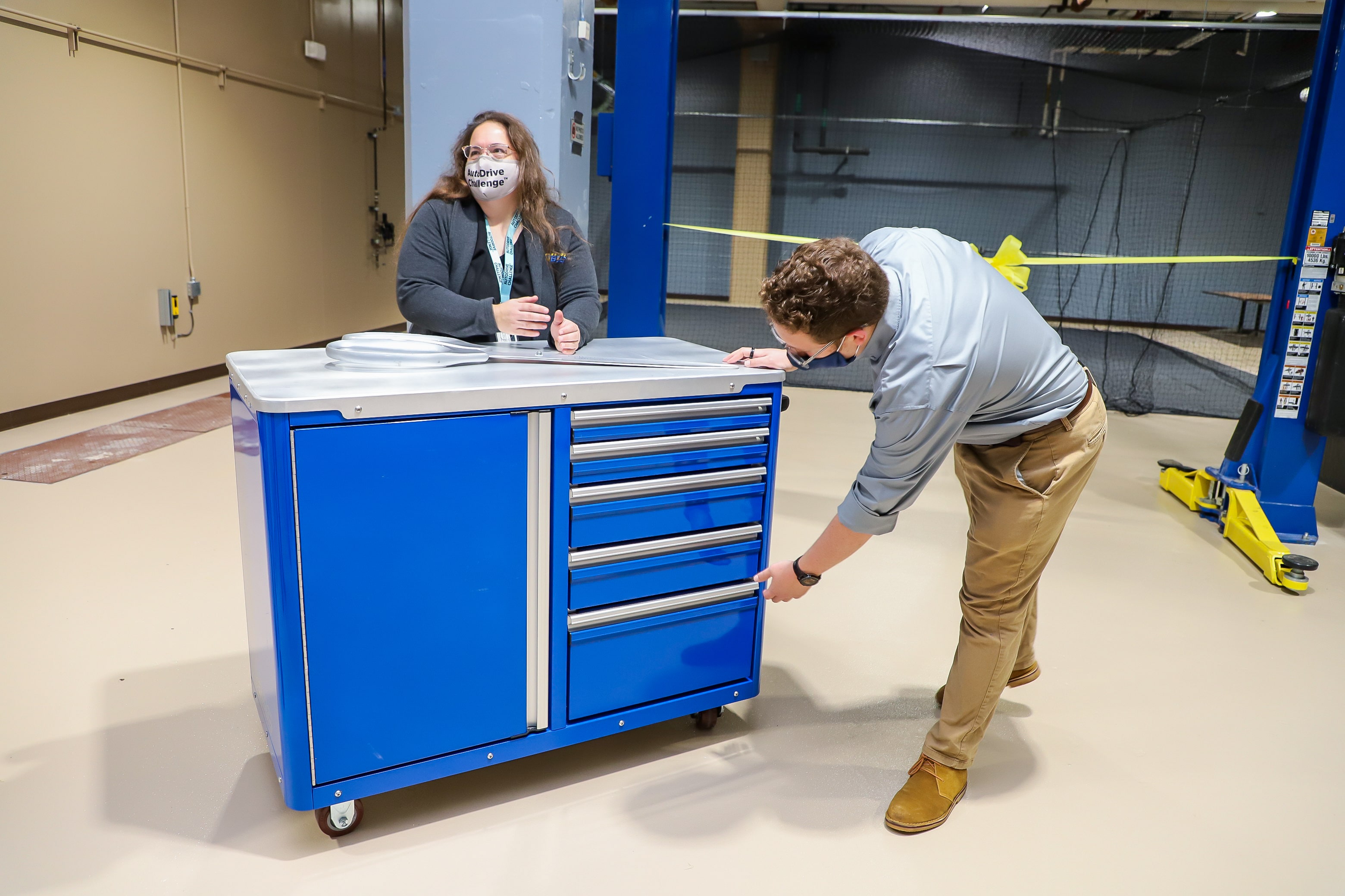 Caleb Burgess ('22, EE) and AutoDrive team faculty advisor Dr. Diane Peters talk about the metal cart the team will outfit with sensors for the first year of the AutoDrive II Challenge.