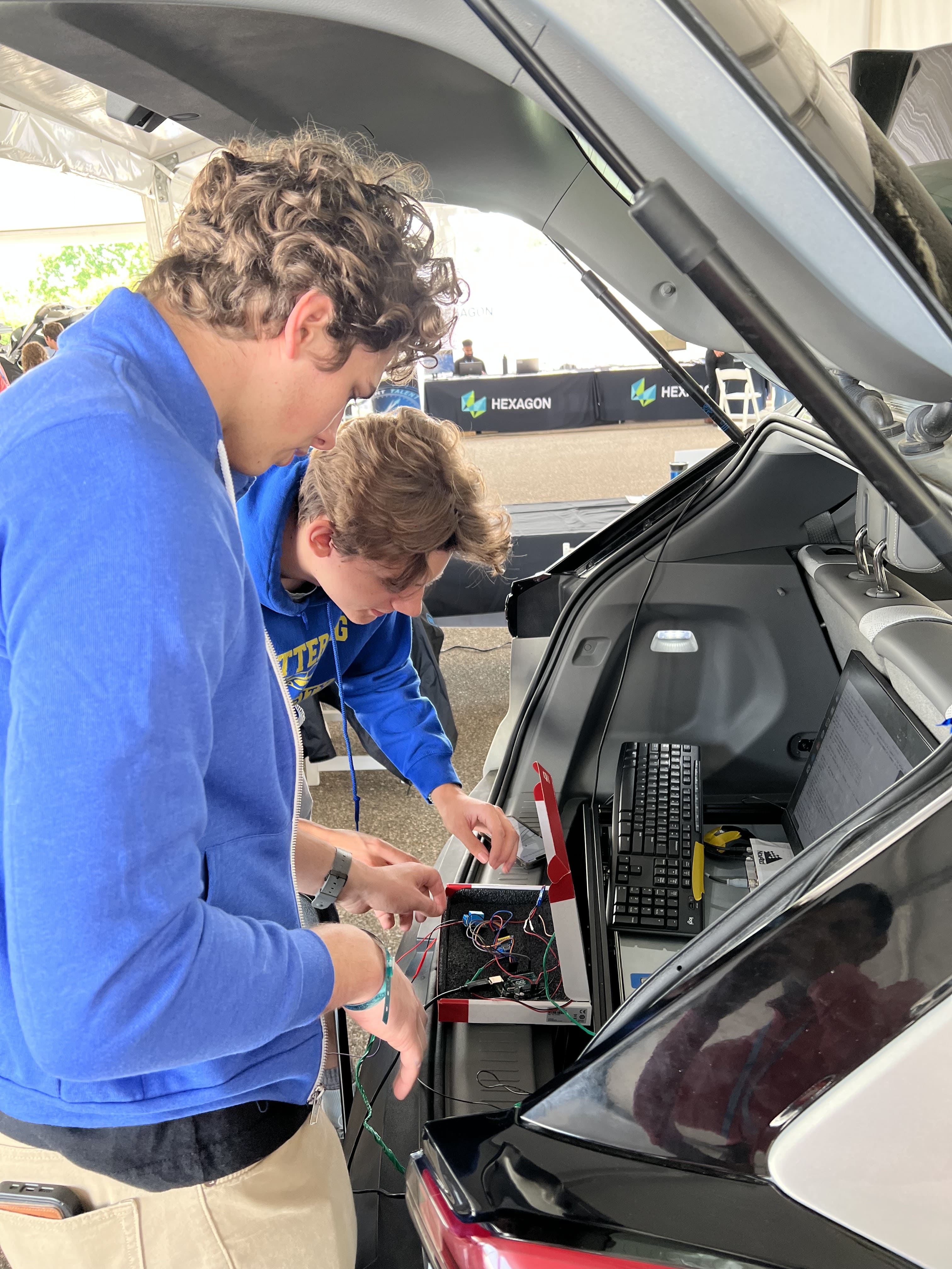 Kettering University students work on their car at the AutoDrive II Challenge.