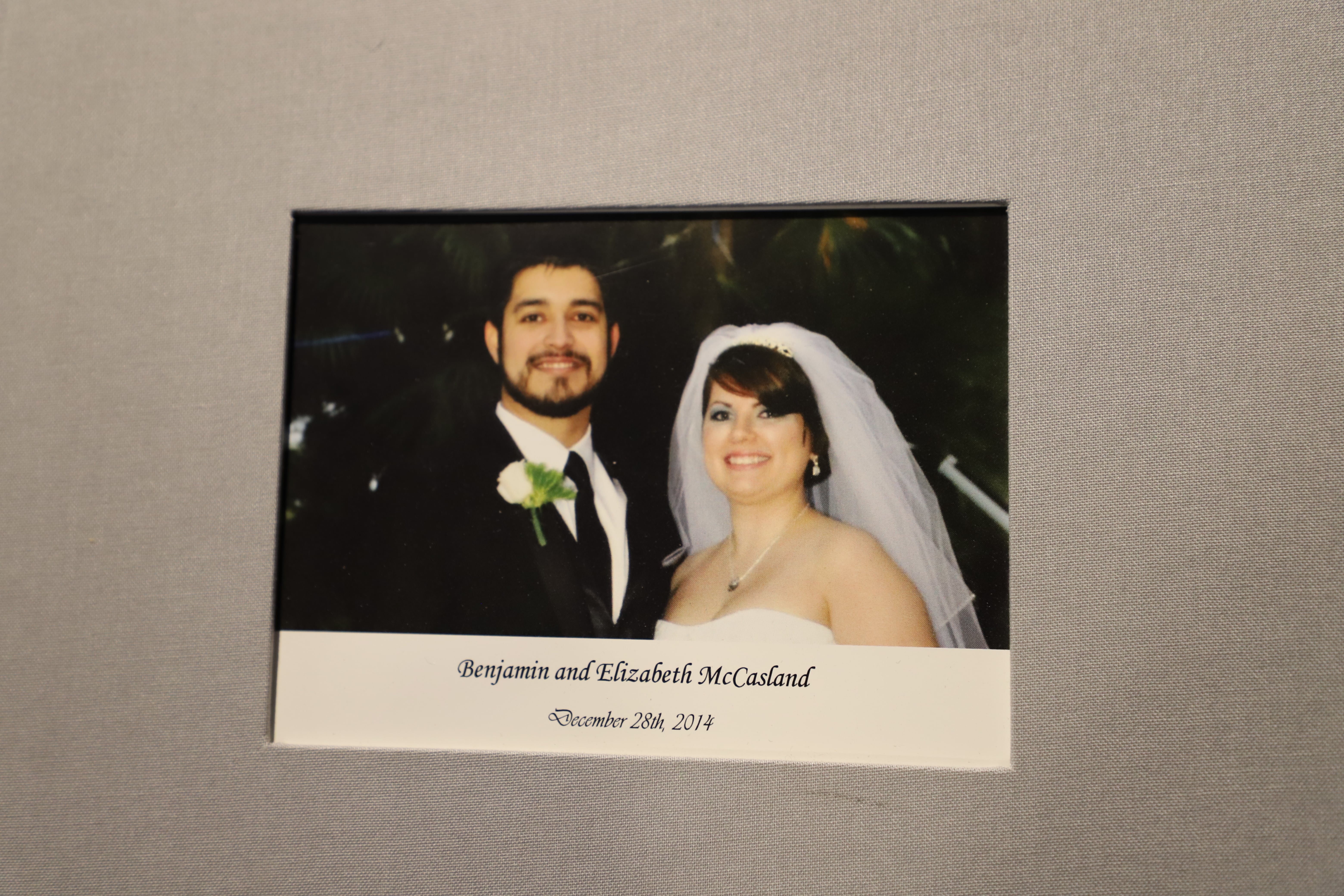 Ben and Liz McCasland's wedding photo on the cover of a wedding album.