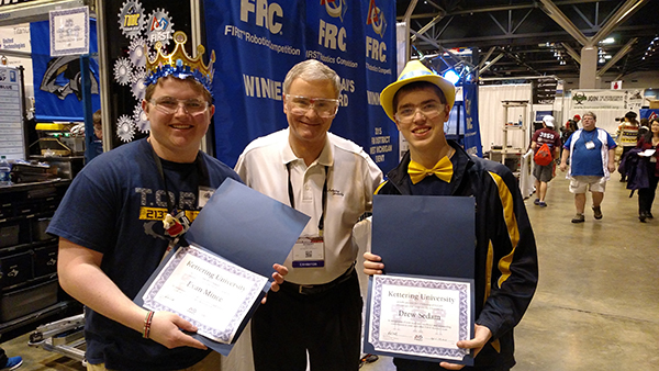 Bob Nichols, director of Kettering University's FIRST Robotics Community Center, with two of this year's scholarship recipients.