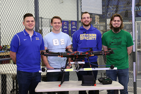 Kettering University students show off the drone they used in their capstone project