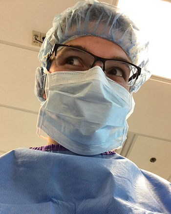 Headshot of Kyle Spengler in scrubs and medical mask