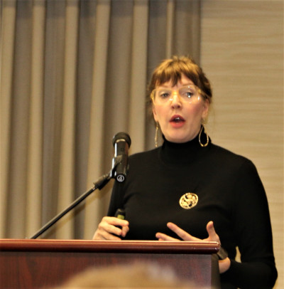Dr. Julia Kiernan, Professor of Communications, spoke at a recent QuadPro symposium.