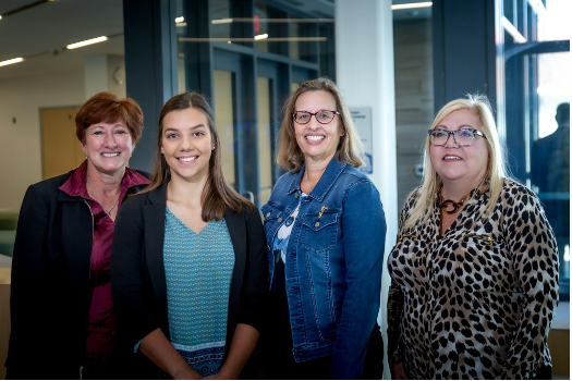 Some of WHW Founding members, Nina Leask ‘87, Sandy Dietrich ‘87 and Darlene Deane ‘88 are pictured with Allison in the Learning Commons. 