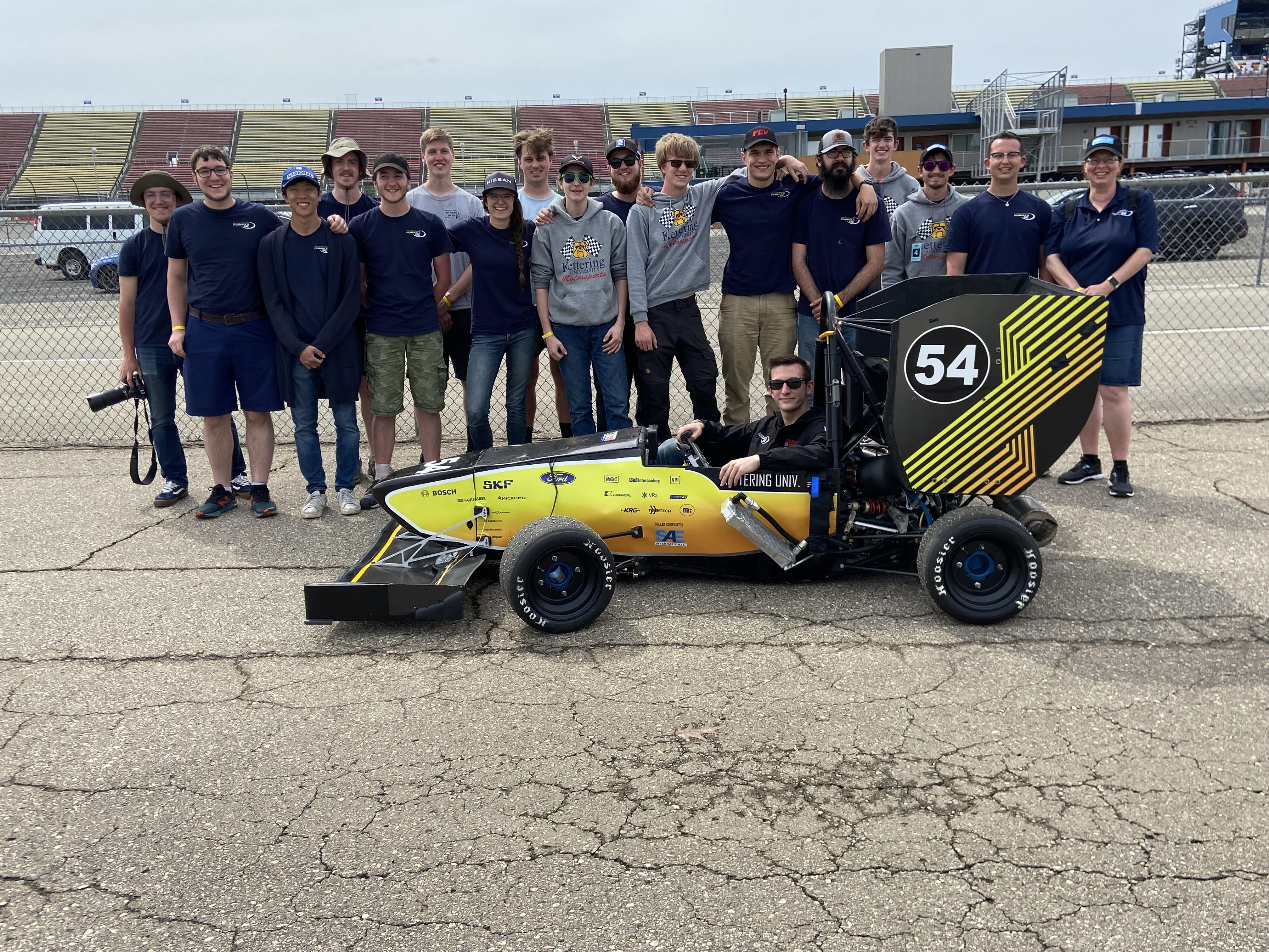 Kettering University's Formula SAE team poses with its car.