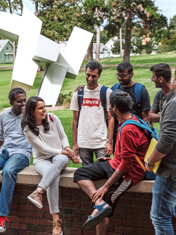 International students enjoy a sunny day on Kettering University's campus.