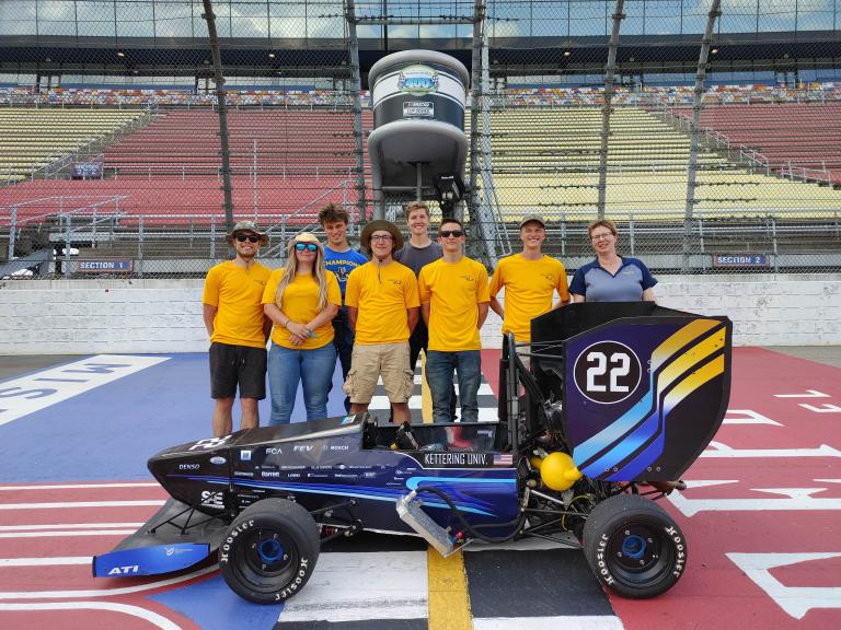 The Kettering University Formula SAE team and 2021 race car.
