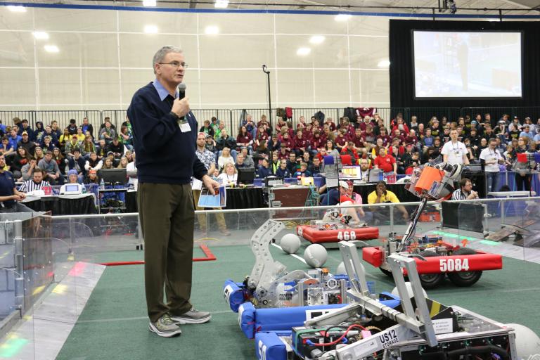 Bob Nichols speaks at a FIRST Robotics Competition.