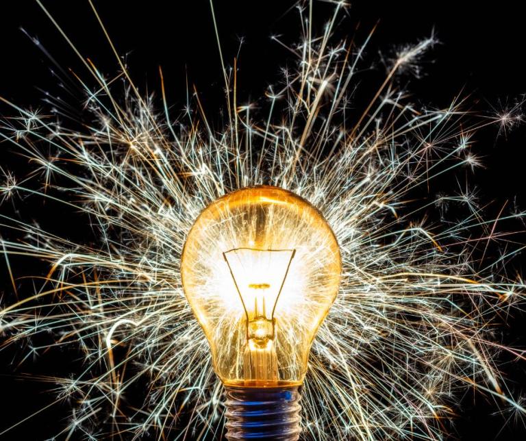 A light bulb filled with sparks.
