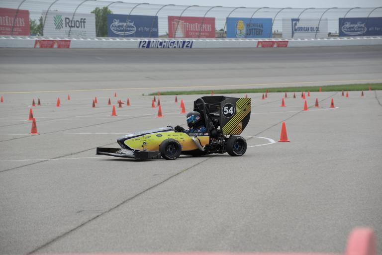 A Kettering University student hits the track in the team's Formula SAE car.