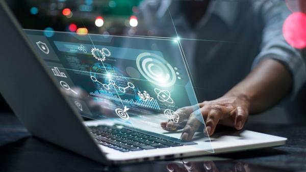 Data scientists. Male programmer using laptop analyzing and developing in various information on futuristic virtual interface screen. Algorithm. marketing and deep learning of artificial intelligence stock photo