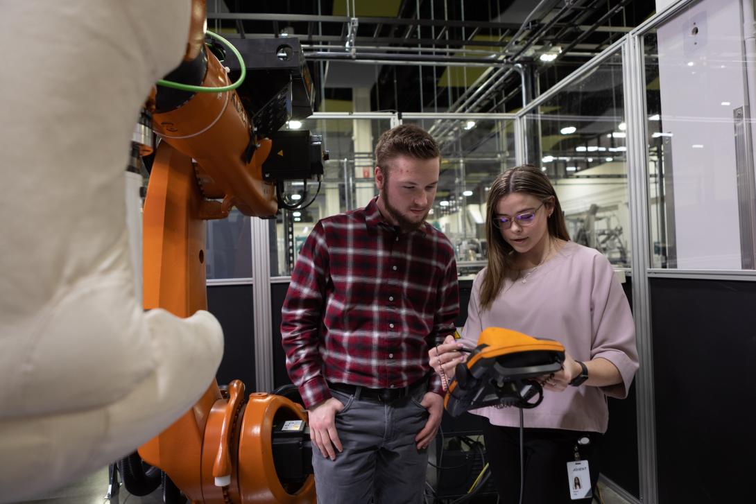 Two co-op students working at Adient
