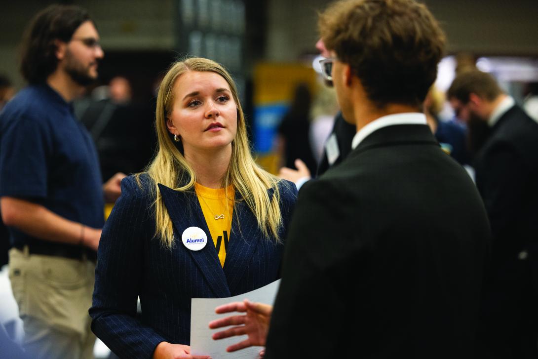 young lady talking to employer