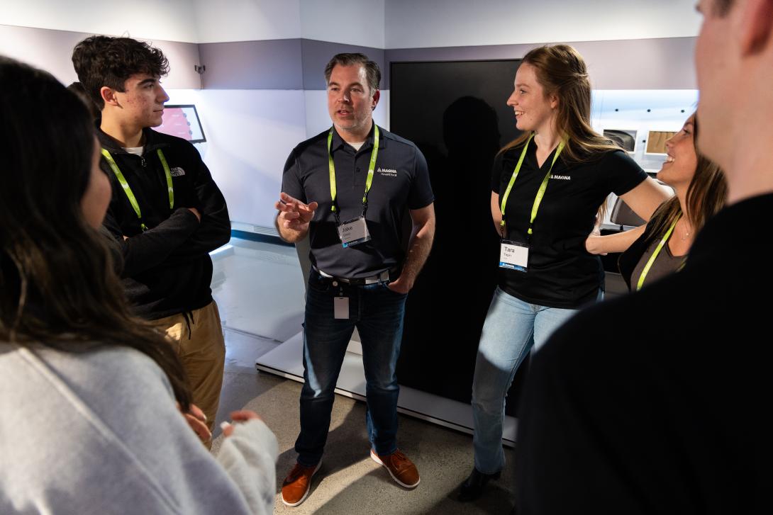 Students talking to MAGNA