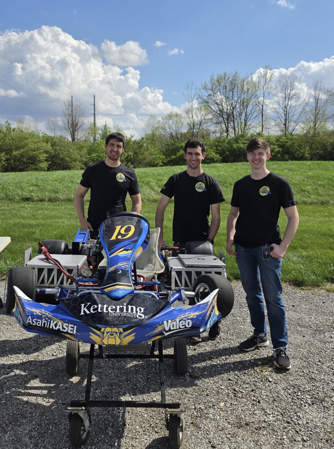 ev kartz team standing behind the competition vehicle