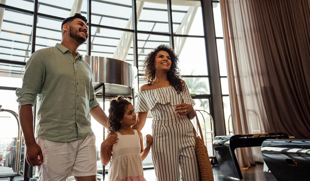 Family walking into a 5 star hotel