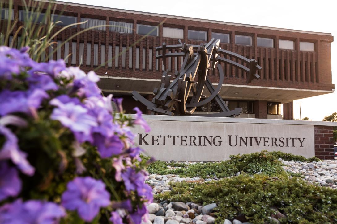 Kettering University's Campus Center with purple flowers
